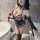 Woman wearing a sexy leopard print catwoman bodysuit costume with lace details and matching accessories.