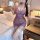A woman poses elegantly in a purple sheer cheongsam, featuring traditional knotted buttons and delicate lace stockings, embod...