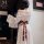 Elegant off-shoulder hanfu robe with intricate lace detailing and a decorative red sash, perfect for traditional chinese atti...