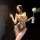 Woman wearing chao mu lingerie set, a sexy backless bodysuit with bow tie and ruffle trim in pure temptation style.