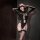 Woman wearing black chao mu qing qu mesh bodysuit with cutouts, garter straps, and id badge.