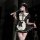 A woman poses in a black and white maid outfit, featuring lace details and a feathered wand accessory, embodying a seductive ...