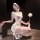 Woman in white chao mu seductive nurse costume lingerie with red heart, blindfold, and feather duster.