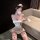 Woman in white nurse lingerie set with red cross details, blindfold, and feather wand — chao mu seductive nurse costume for a...