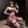 Woman in red plaid chao mu lingerie set, posing with phone, wearing thigh-highs and heels.