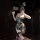 Woman posing in chao mu sensual lingerie set, a sheer polka dot maid outfit with bow and backless design.