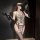 Woman modeling chao mu sexy lingerie bodysuit with sheer embroidered lace, open cups, garter straps, and black gloves holding...