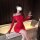 A woman poses elegantly in a red chao mu sexy lingerie dress, featuring an off-shoulder design and side waist drawstring, per...