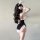 Woman wearing chao mu sexy lingerie set – pure & tempting lace babydoll with bunny ears, back view, black and pink design.