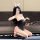 Woman in black lace babydoll lingerie with bunny ears, holding floral fan, kneeling on floor for chao mu sexy lingerie set.