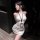Woman in white ribbed bodycon mini dress with halter neck, blindfold, and lanyard id badge. chao mu sexy secretary costume se...