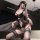 Woman kneeling in black chaomu lace butterfly tie-up lingerie set with sheer panels, garter straps, and delicate lace detaili...