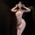 Woman wearing chaomu lace sensual bodysuit with sheer bust, lace detailing, and matching garter stockings.
