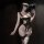 Woman in black chaomu lingerie set with sheer mesh, underwire top, cutouts, and lace stockings, holding a feather fan.