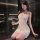 Woman in white lace cami lingerie set with sheer straps, holding wine glass, blindfolded, elegant and alluring.