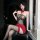 Woman modeling chaomu sexy strapless bodysuit with lace top, red high-waisted skirt, and black stockings.