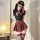 Model wearing chaomu temptation lingerie set with jk pleated skirt, black crop top, and thigh-high stockings.