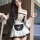 Woman wearing cherry love lingerie mini skirt set, a sweet and seductive maid costume with bow backless design for role play.