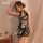 A woman poses elegantly wearing a floral-patterned chinese-inspired dress, perfect for festive occasions. the halter neck des...