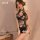 A woman poses elegantly wearing a floral-patterned chinese-inspired lingerie set, featuring a halter neck design and festive ...