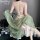 A woman wears a vintage floral lace chemise set with a sheer green shawl, featuring a seductive no-remove design.