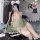 A woman poses in a vintage-inspired silk-look chemise set, featuring floral lace and seductive design elements, perfect for r...