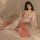 A woman models a sheer chiffon chinese traditional doudou lingerie set, featuring delicate floral embroidery and flowing fabr...