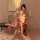 A woman elegantly poses wearing a sheer chinese traditional embroidery lingerie set, featuring a delicate bodice and flowing ...