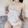 White lace-trimmed chinese-style sensual lingerie set featuring a silky bodysuit and thong, inspired by traditional silk cheo...