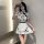 A stylish model showcases a black and white chinese new year-themed dress inspired by red silk, featuring lace details and a ...