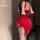 Sexy red bunny girl costume with asymmetrical corset design, festive holiday lingerie ensemble featuring long gloves and thig...
