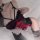 Sexy red and black lace bodysuit with bunny ears, adjustable straps, and snap crotch for a festive christmas look.