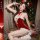Sexy christmas-themed red velvet lingerie set featuring a naughty costume with antler headband and suspender stockings.