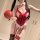 Sexy christmas naughty bodysuit with open-crotch design, perfect for role play and holiday fun. red velvet with bow detail.
