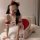 A playful and alluring christmas-themed cosplay maid costume featuring a red bunny girl outfit with ruffled details, perfect ...