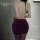 Woman wearing chu rui deep v-neck lace-up bodycon dress, back view showing open design and purple stockings.