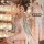 A woman wearing a classical chinese dudou set, featuring a palace-style hanfu bra top paired with sheer chiffon innerwear, ho...