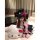 A woman poses with a hello kitty plush toy, wearing a cute maid costume set featuring playful elements and vibrant colors. th...