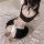 Cute maid costume featuring a black top with back tie, white apron with waist tie, and headband set for flirty role play outf...