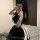 A person wearing a cute maid dress with a black and white checkered skirt, featuring a large bow at the waist. the outfit inc...