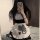A person wearing a cute maid dress with black and white checkered patterns, featuring bows and cat paw designs, perfect for c...