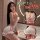 Woman wearing cute small-bust lingerie set, sexy maid costume with low-cut top and lace-trimmed shorts, bedroom-ready pure te...