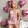 A woman poses in a cute sweet lace bodysuit adorned with bows and cut-outs, perfect for romantic occasions. the sheer design ...