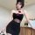Woman wearing black mesh lace floral halter bodysuit with red roses, backless bodycon dress for sexy evening style.
