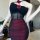 Woman wearing a dark glam mesh lace floral halter bodysuit, featuring a sexy backless design and bodycon fit.