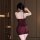 Woman wearing dark romance lace bodysuit, sheer mesh lingerie with rose details, back view showing elegant fit for curvy figu...