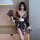 A woman poses elegantly wearing a deep v geisha-inspired sensual kimono robe, featuring intricate floral patterns and delicat...