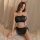 Woman wearing black devil-themed lingerie set with red heart details, horns, and lace trim—seductive three-piece costume for ...
