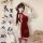 Red silk qipao costume with matching stockings, elegant design perfect for festive celebrations and special occasions.
