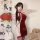 Red silk qipao costume with delicate lace trim, perfect for new years eve, offering elegant allure and seductive charm.